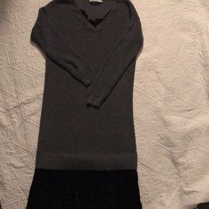 Sweater dress with lace trim.